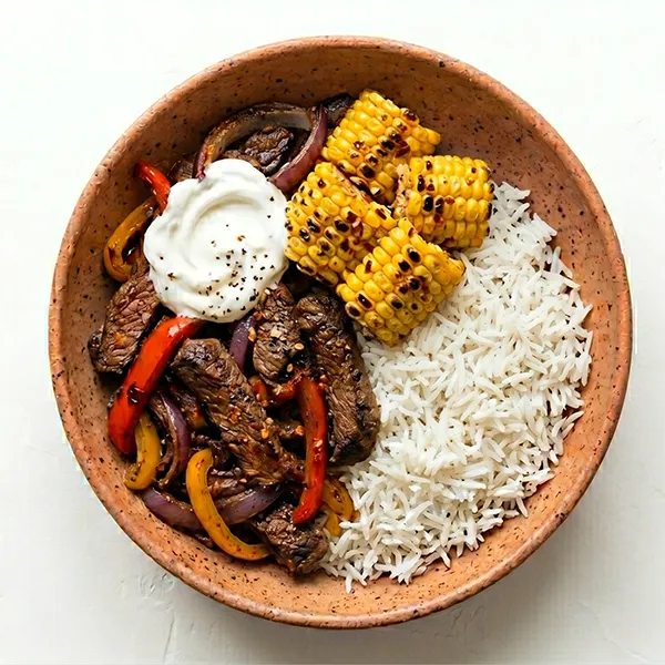 Southwest Beef Fajita Bowl With Roasted Pepper , Corn Cob And Sour Cream